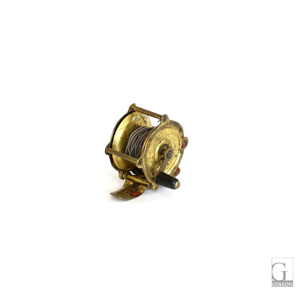 Small Vintage Brass Fishing Reel. 2″ x 2.5″ x 2″H - $65  GARY GIBSON  INTERIOR DESIGN – GIBSON SHOWROOM – GIBSON STUDIO