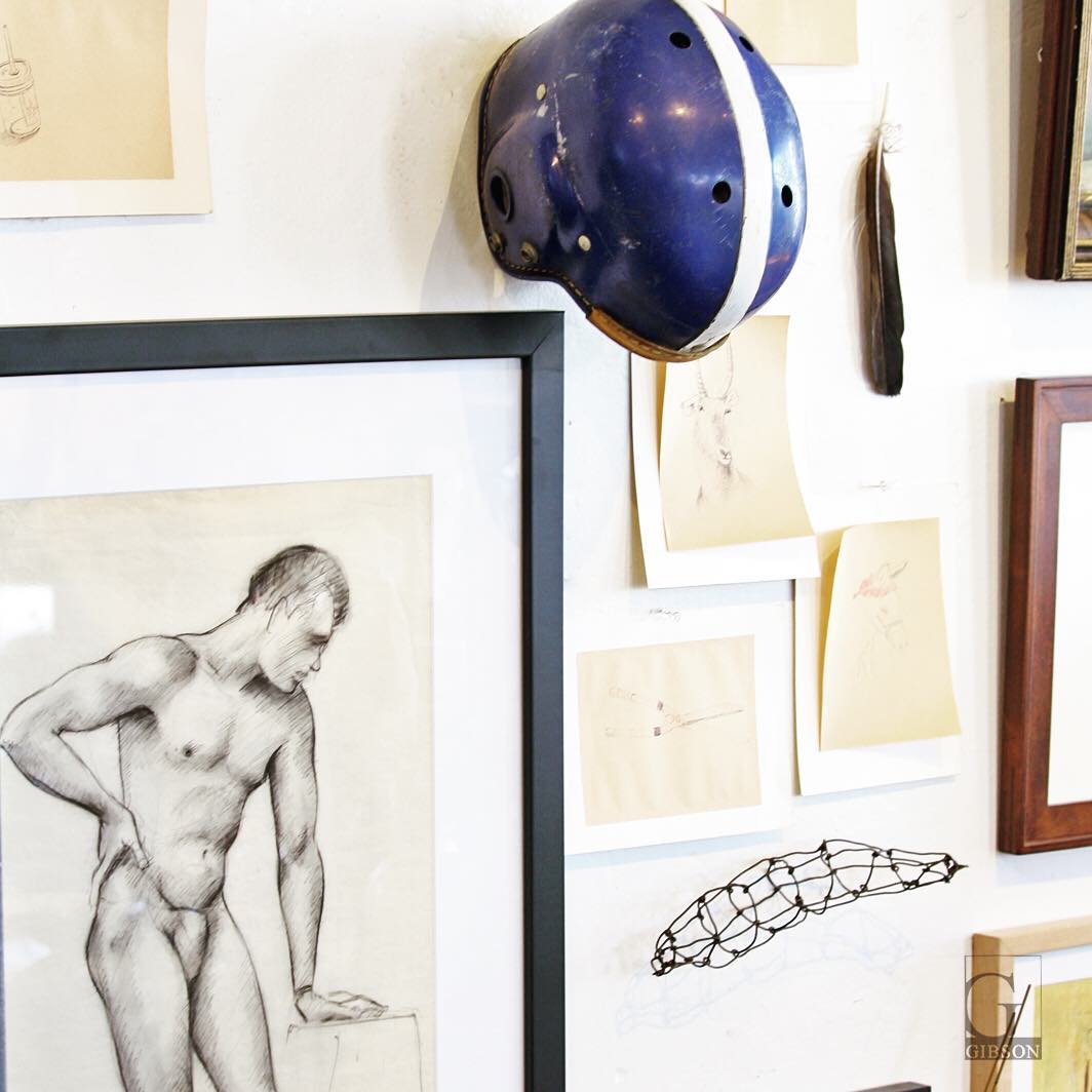 Framed nude male figure drawing - $425. Vintage blue helmet - $95. Assorted  drawings on newsprint by The Ditty Bops - $150/ea. Wire pod by Michael Koch  - $225. #shopping #interior #designer #